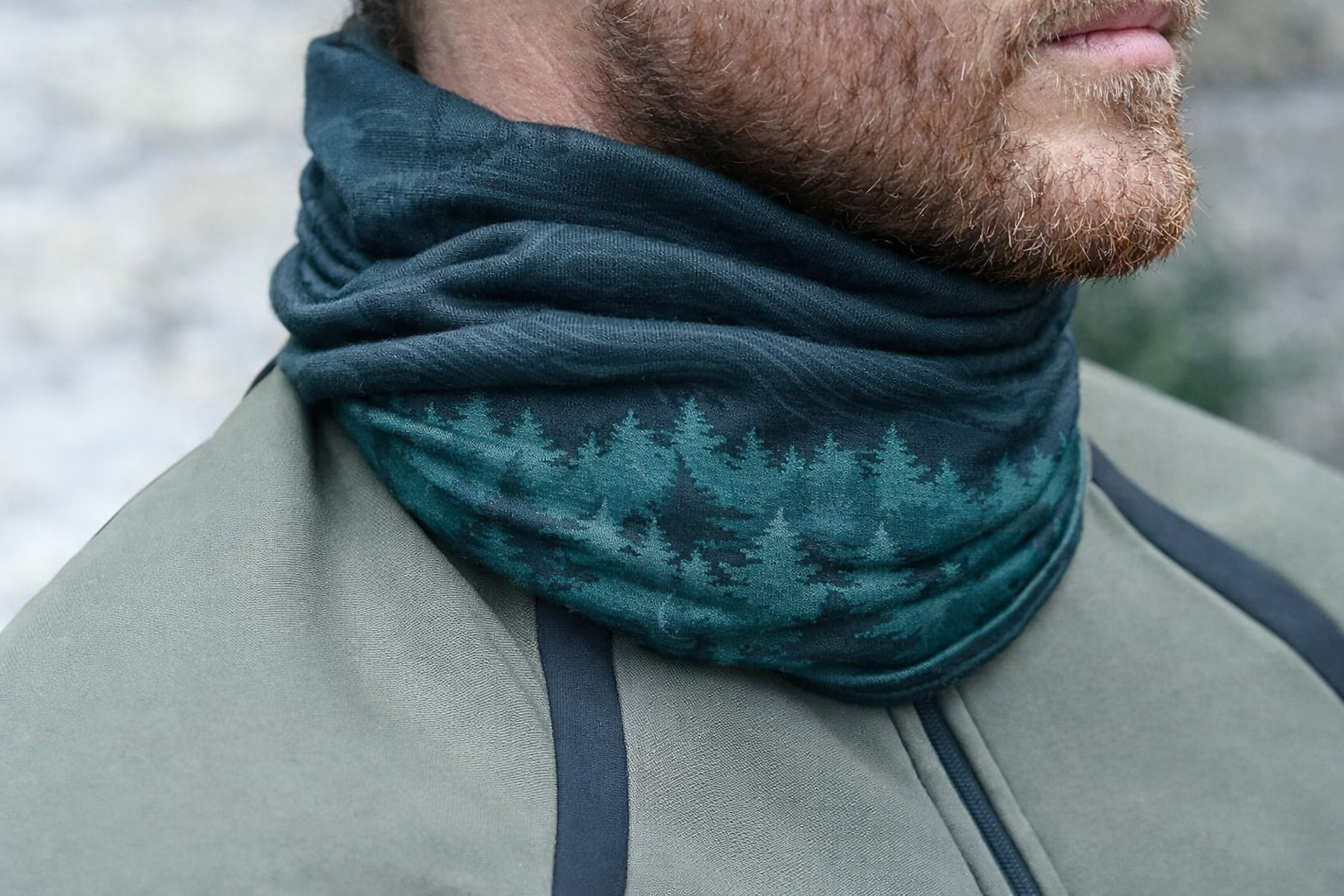 Person wearing a neck gaiter with a blurred natural background